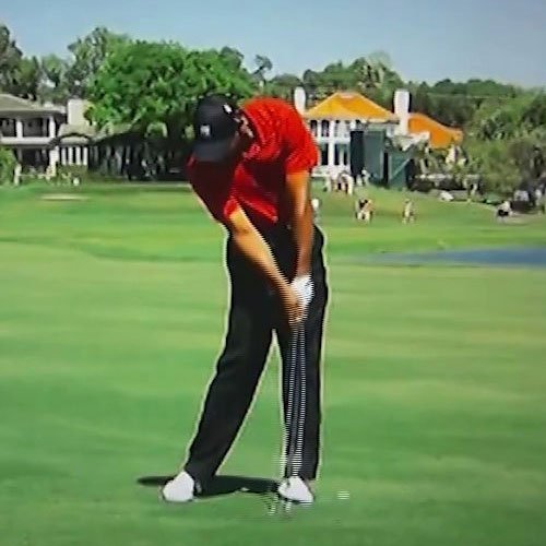 Download Professional Golfer Sam Burns In Perfect Golf Impact Stance