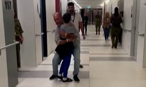 Israeli Boy Embraces Family Members In Hospital Corridor After Hostage