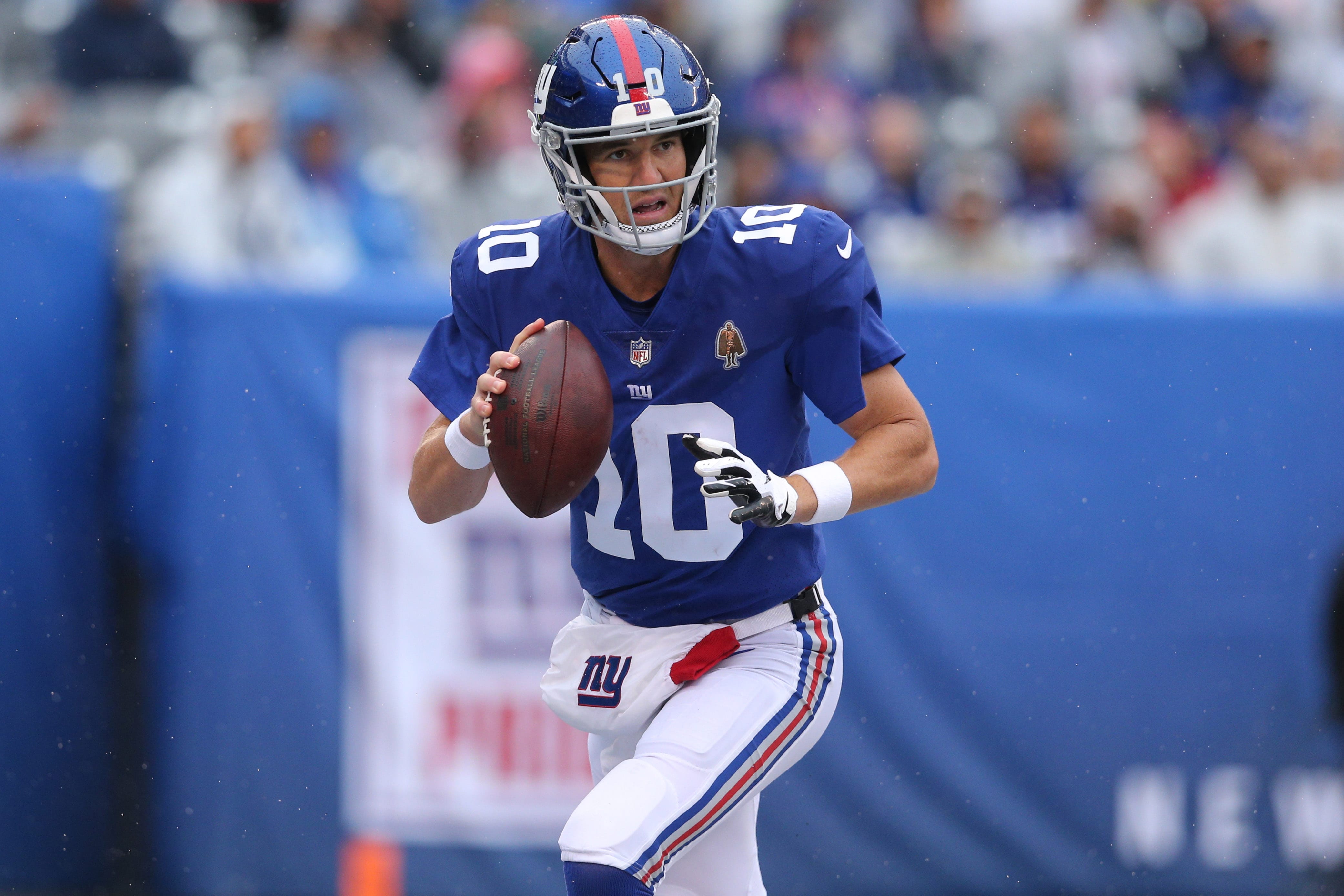 New York Giants Quarterback Eli Manning Holds Up The Vince Lombardi