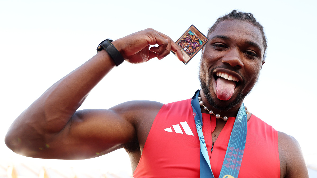 Noah Lyles With The Blue Eyes White Dragon Yu Gi Oh Card Before His 9