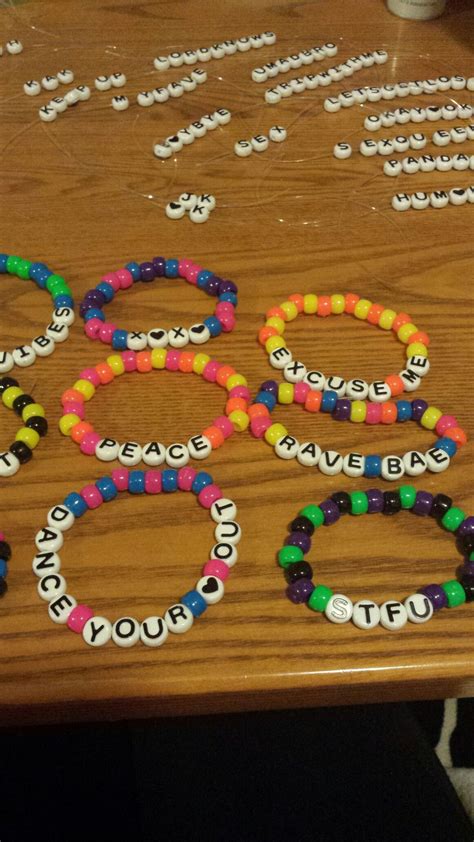 Several Bracelets Are Arranged On A Table With Words Spelled Out In